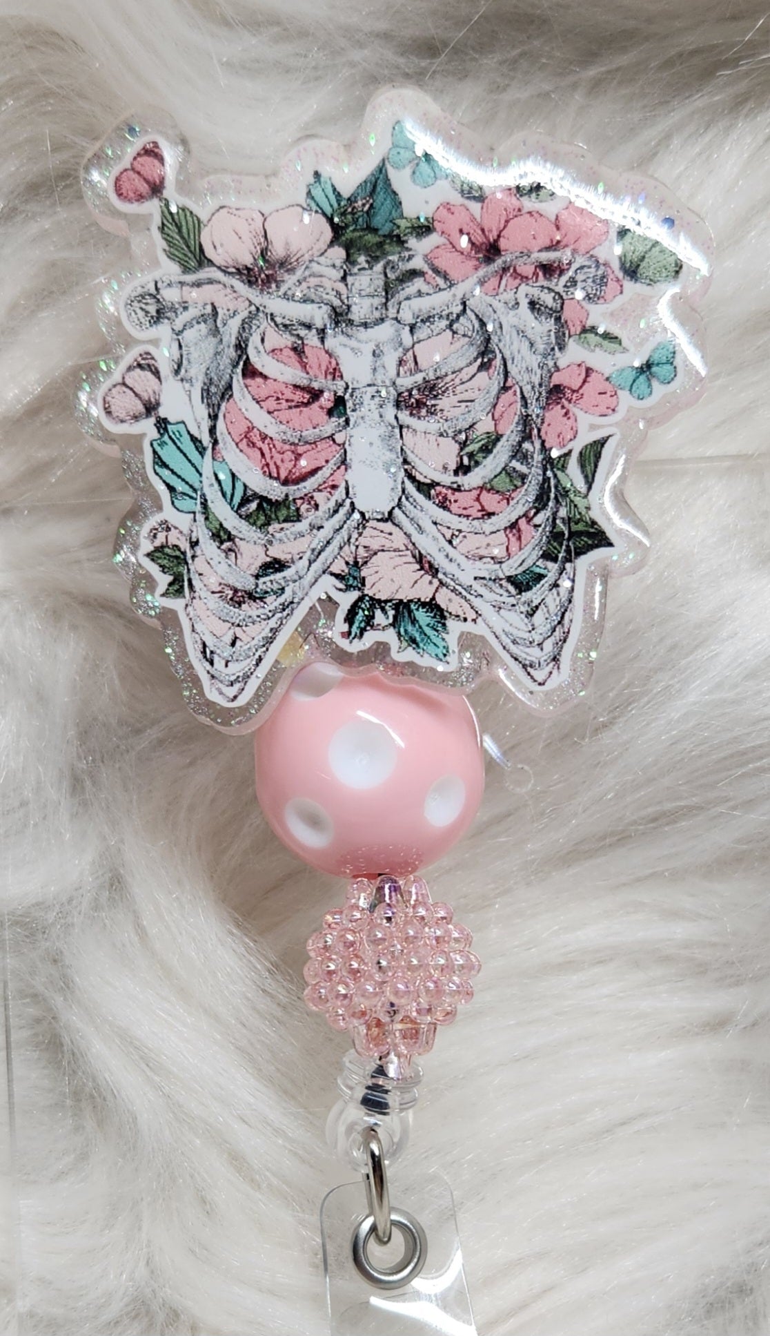 Ribs and Flowers Badge Reel Face