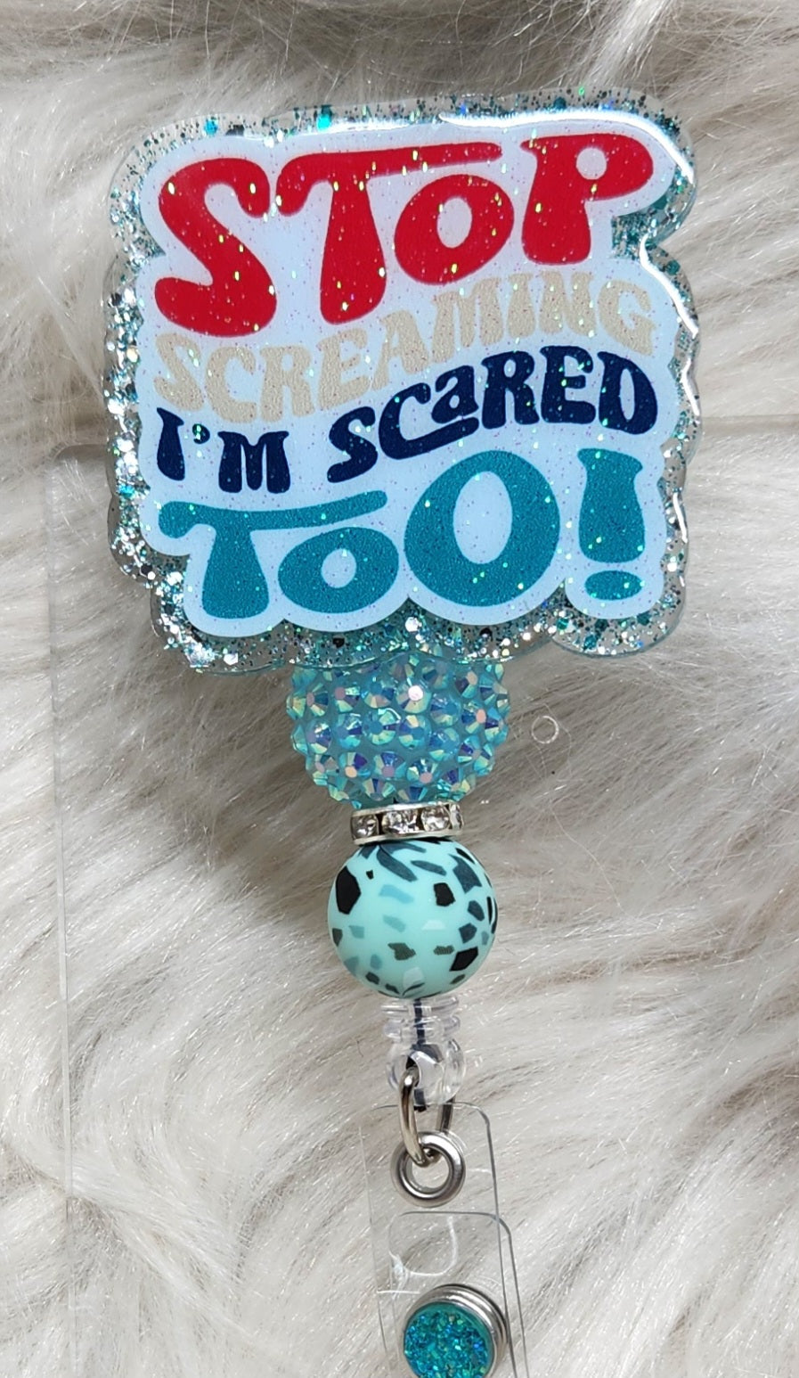 Stop Screaming Badge Reel Face