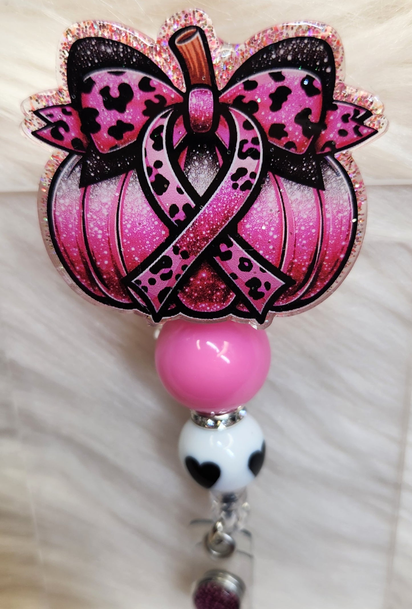 Pink Pumpkin Badge Reel Face