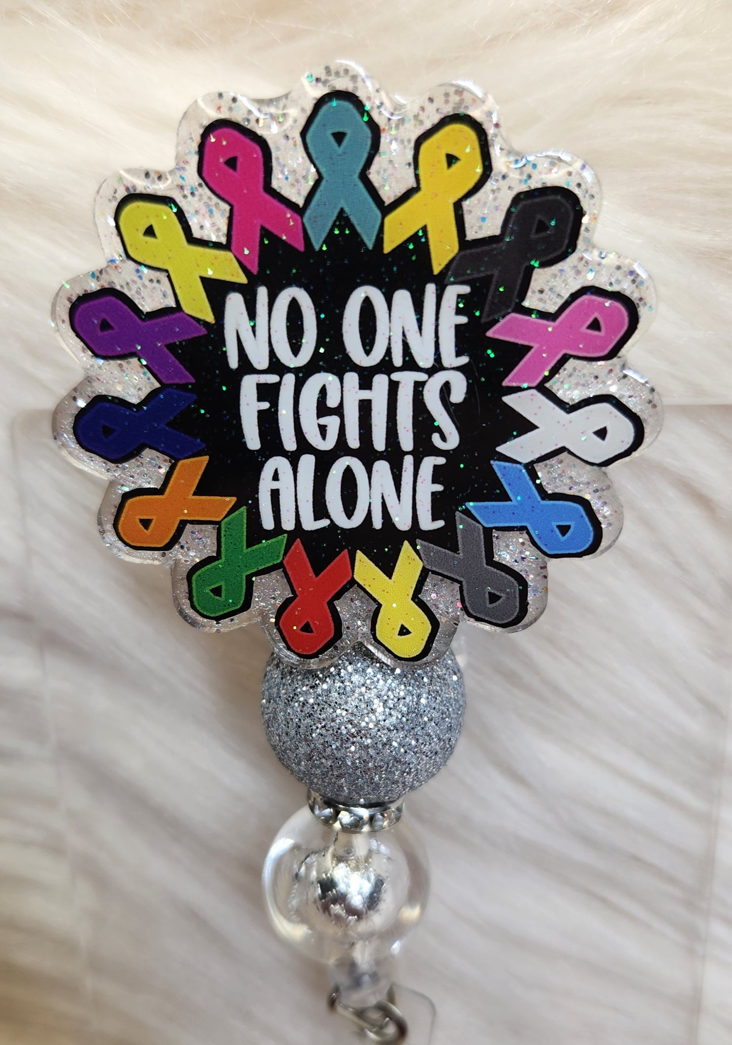 No One Fights Alone Badge Reel Face
