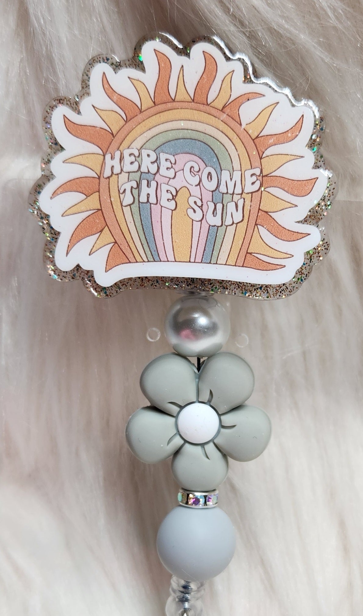 Here Come The Sun Badge Reel Face
