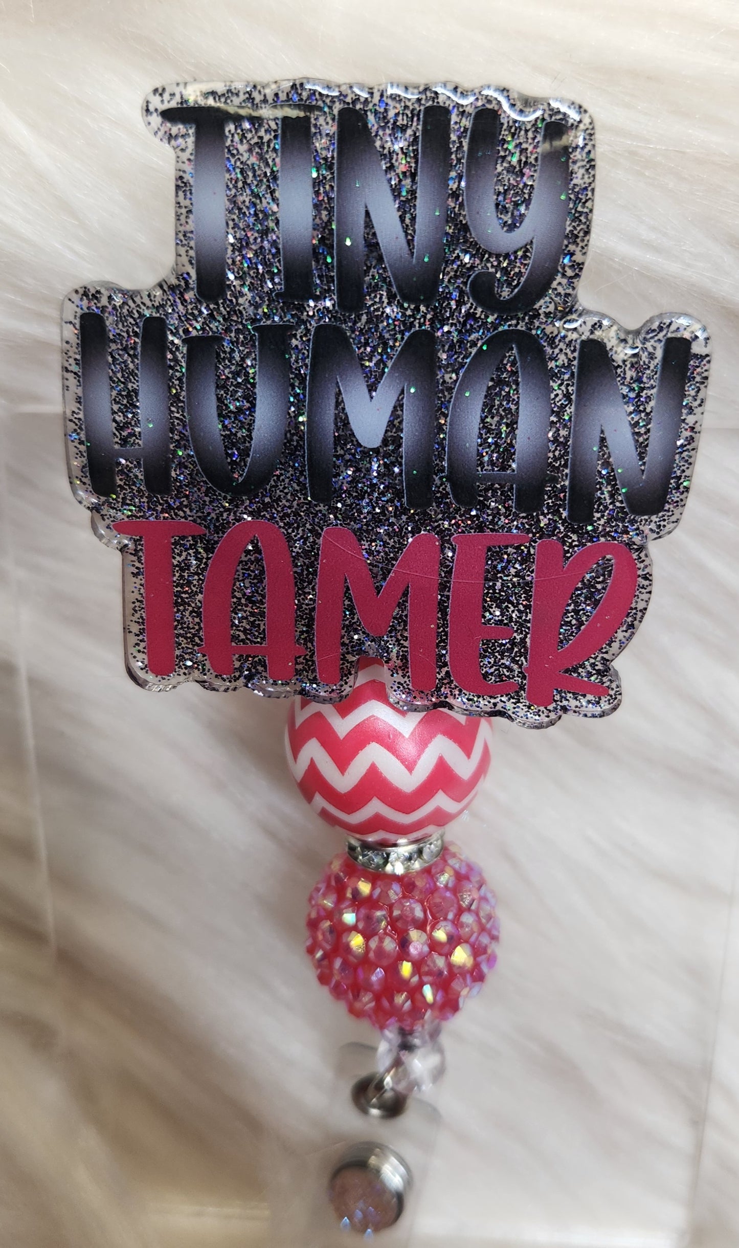 Tiny Himan Tamer Badge Reel Face