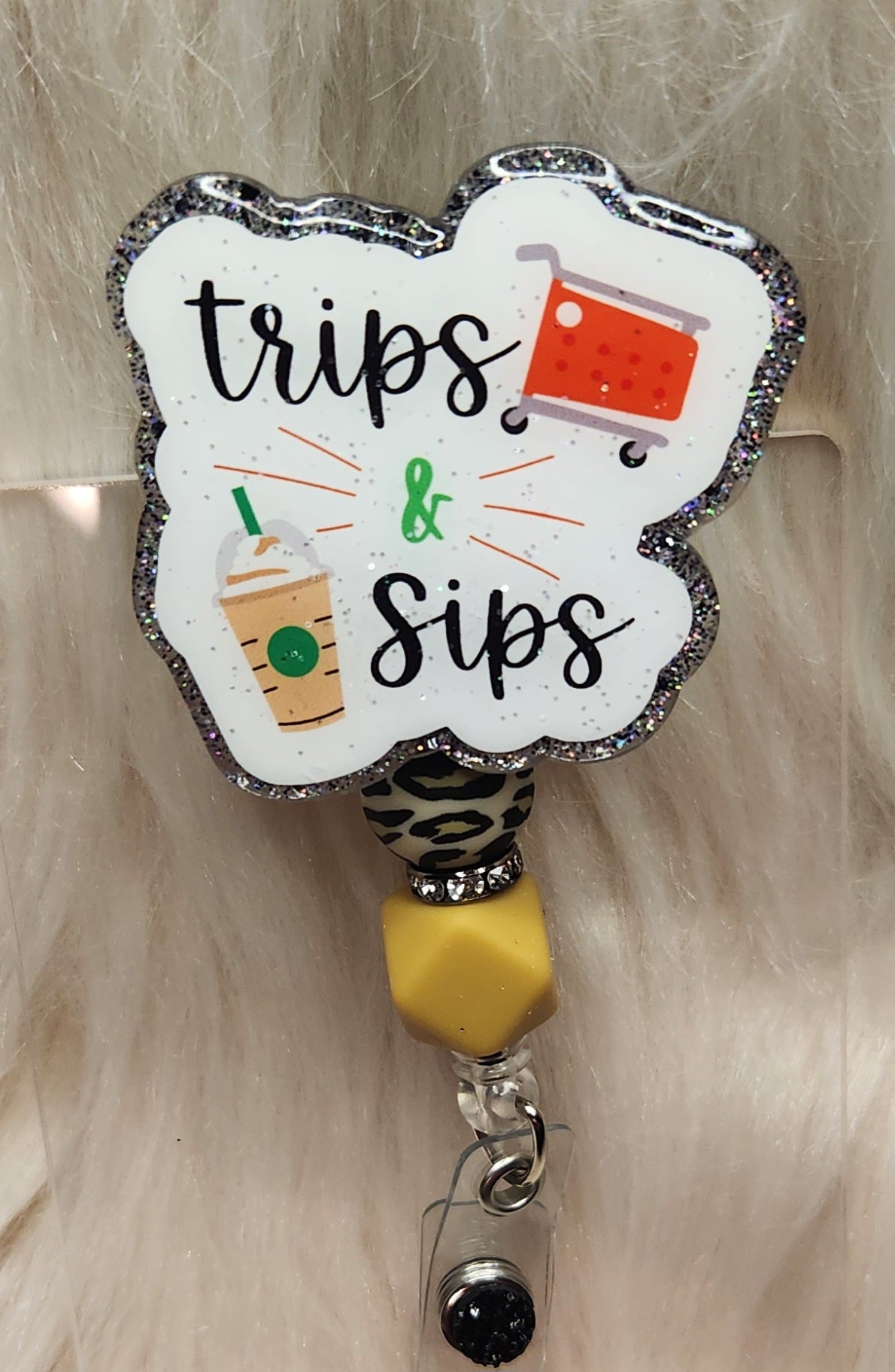 Trips & Sips Badge Reel Face