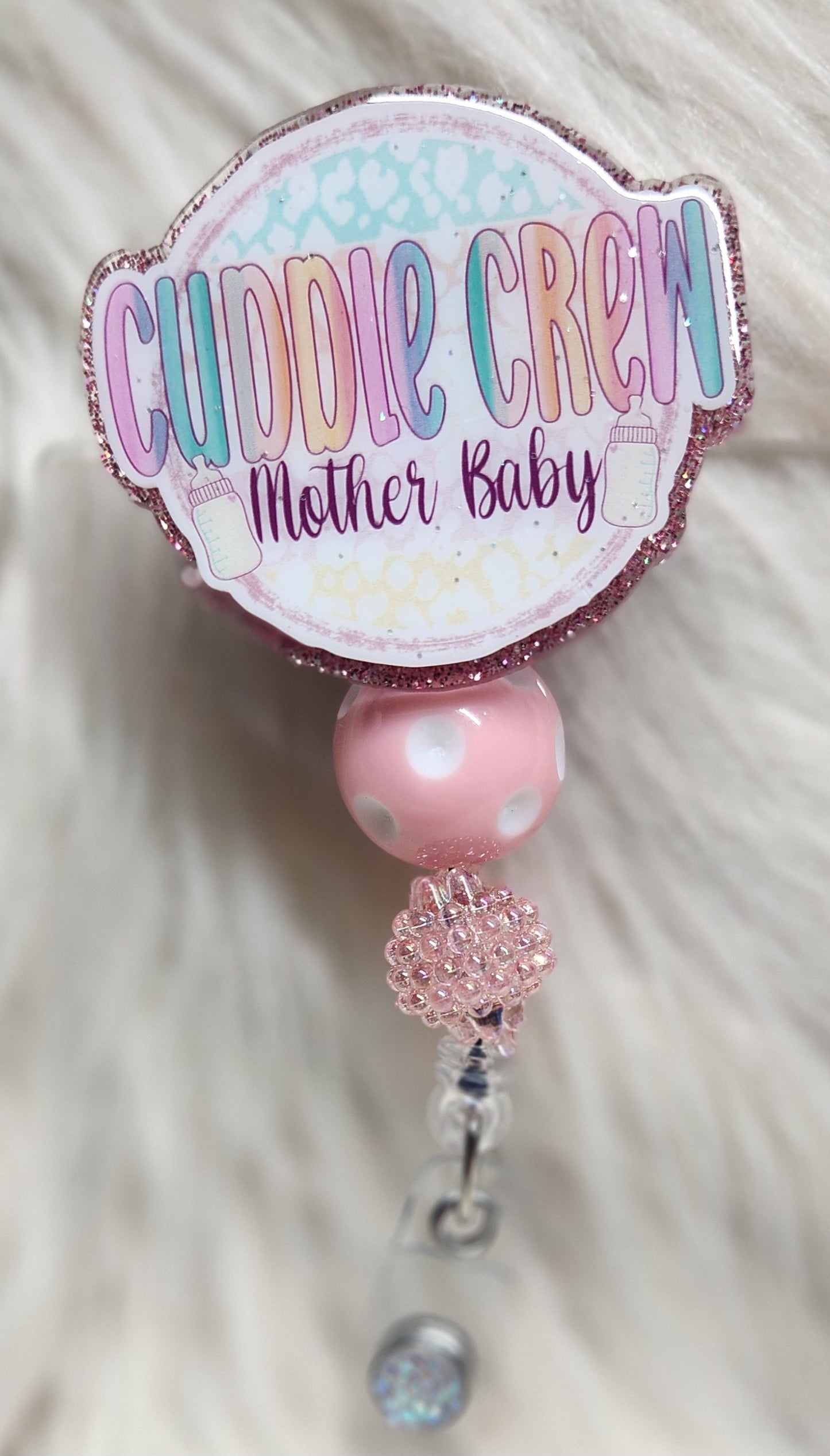 Cuddle Crew Badge reel face
