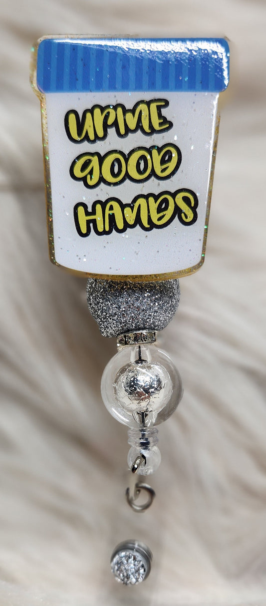 Urine Good Hands Badge Reel Face