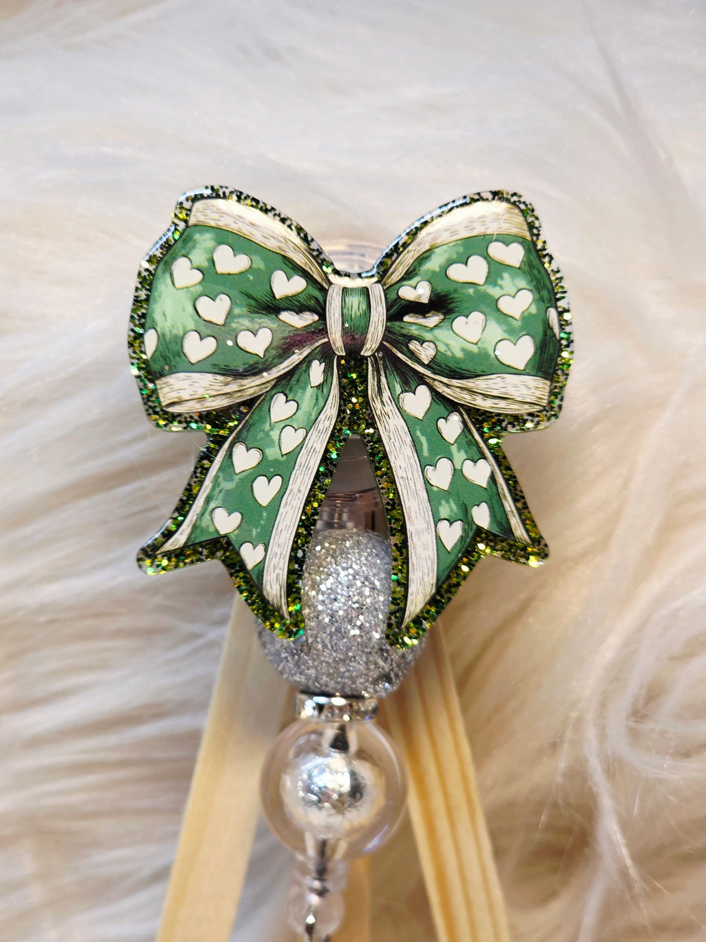 Green Bow Badge Reel Face