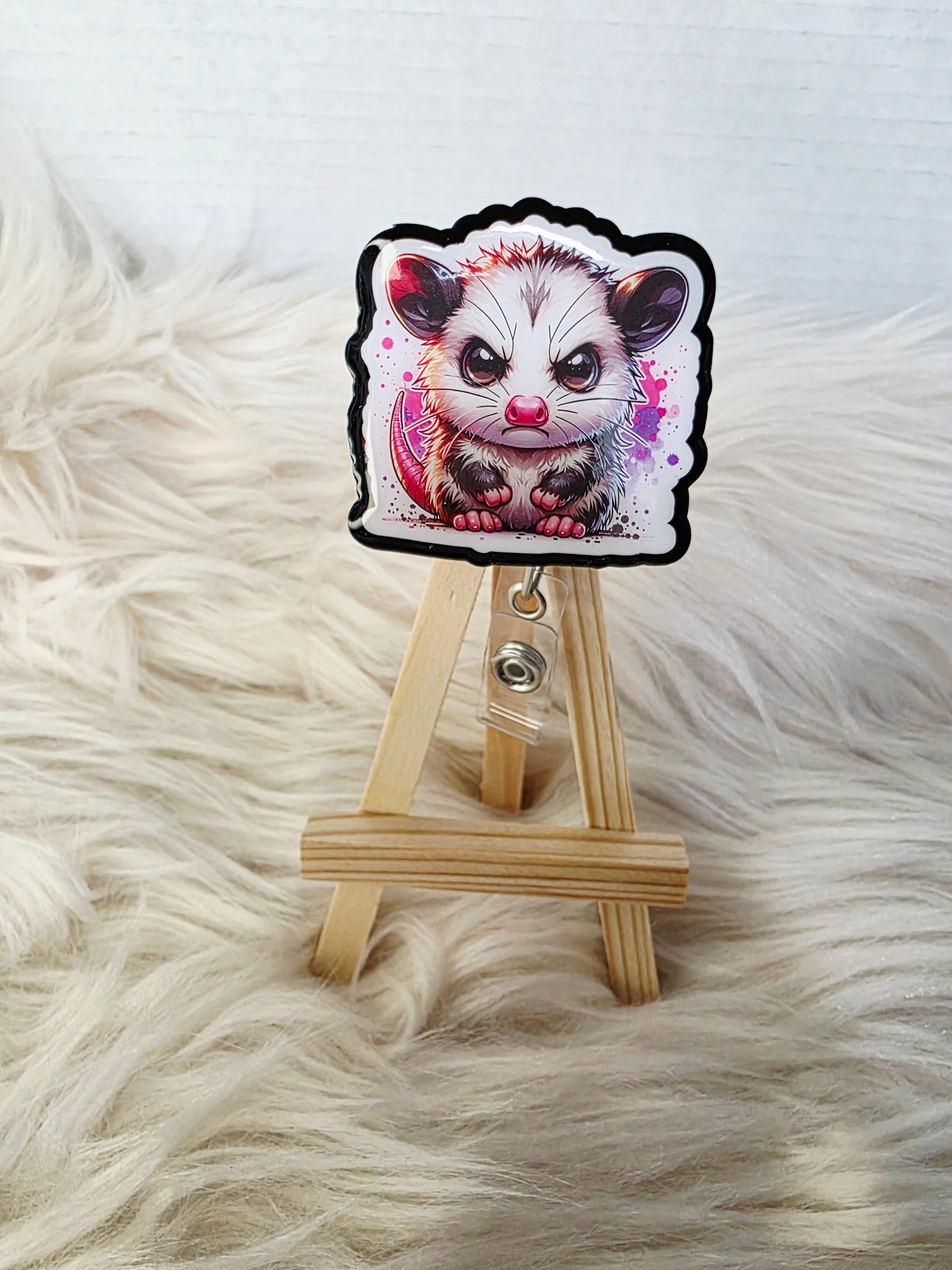 Angry Opossum Badge Reel Face