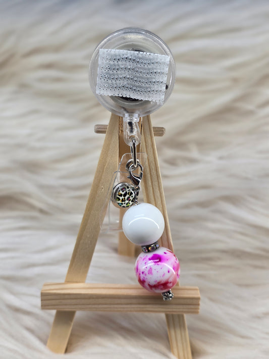 Pink/Red Splatter Badge Reel Charm