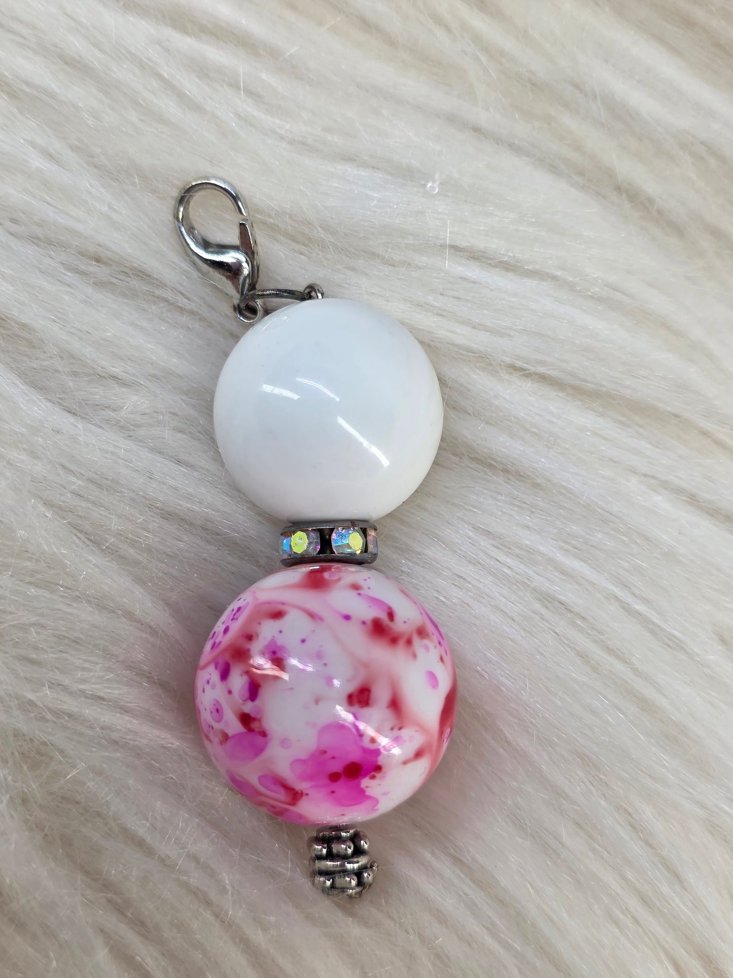Pink/Red Splatter Badge Reel Charm