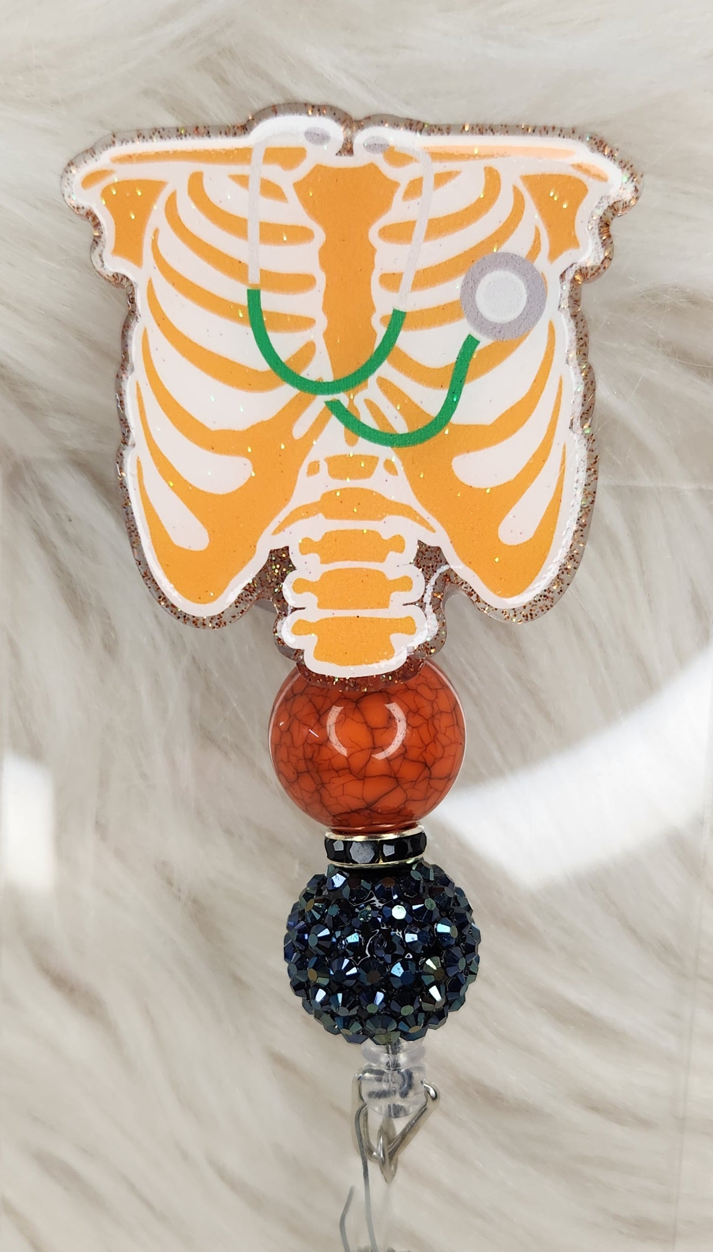 Orange Ribcage Badge Reel Face
