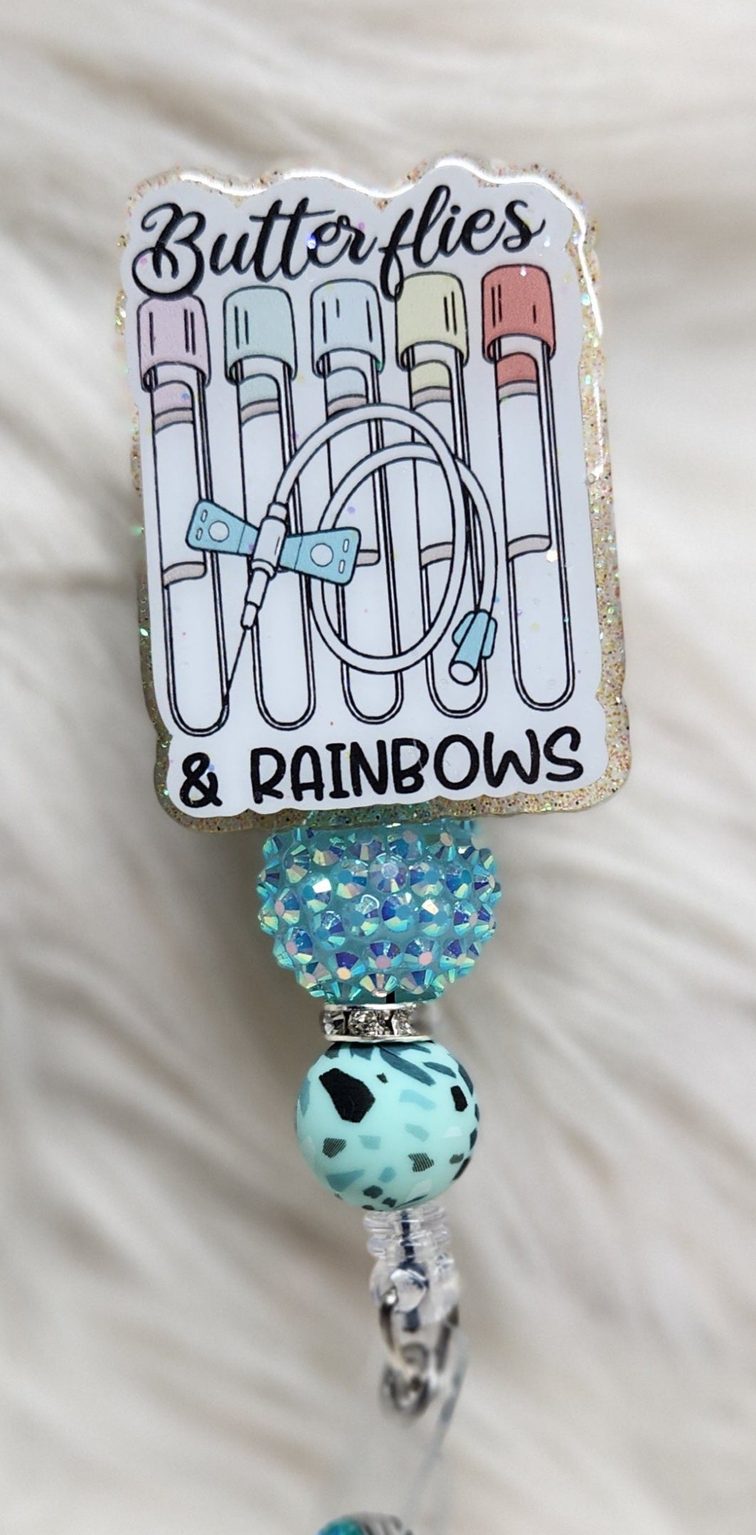Butterflies and Rainbows Badge Reel Face
