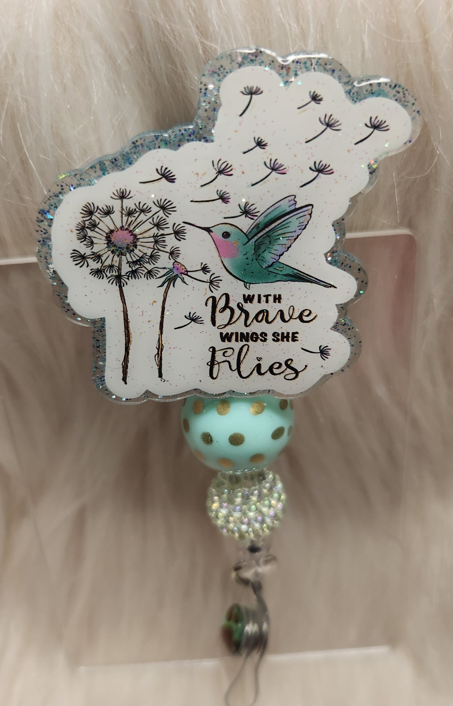 She Flies Badge Reel Face