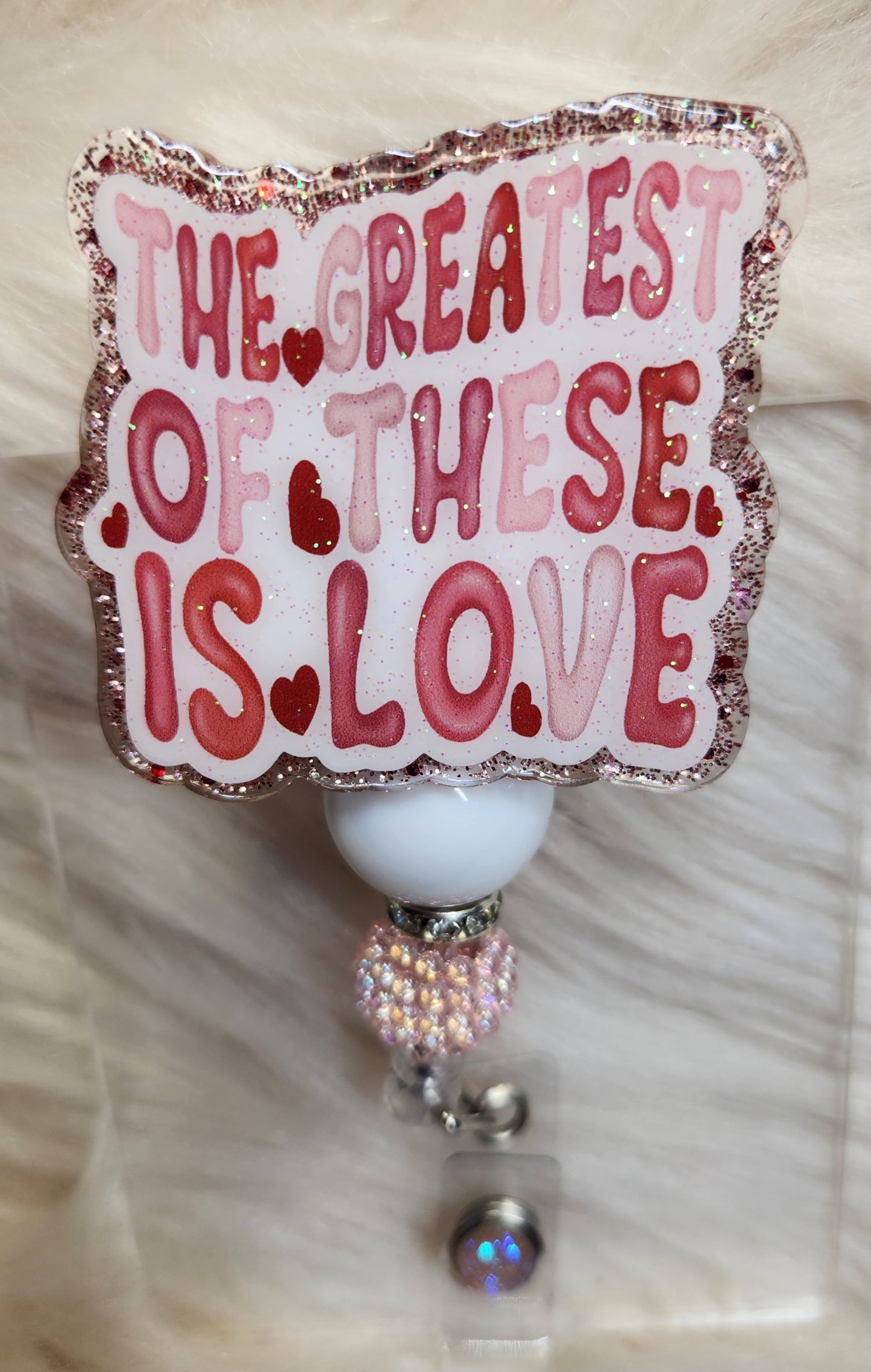 The Greatest is Love Badge Reel Face