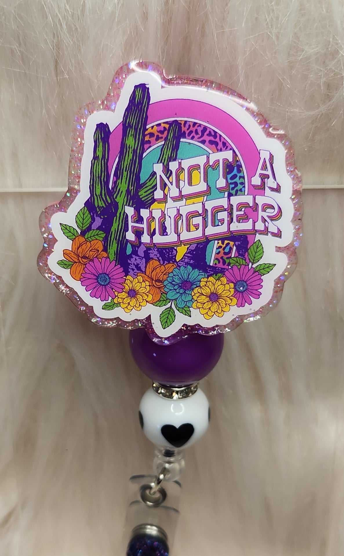 Not A Hugger Badge Reel Face